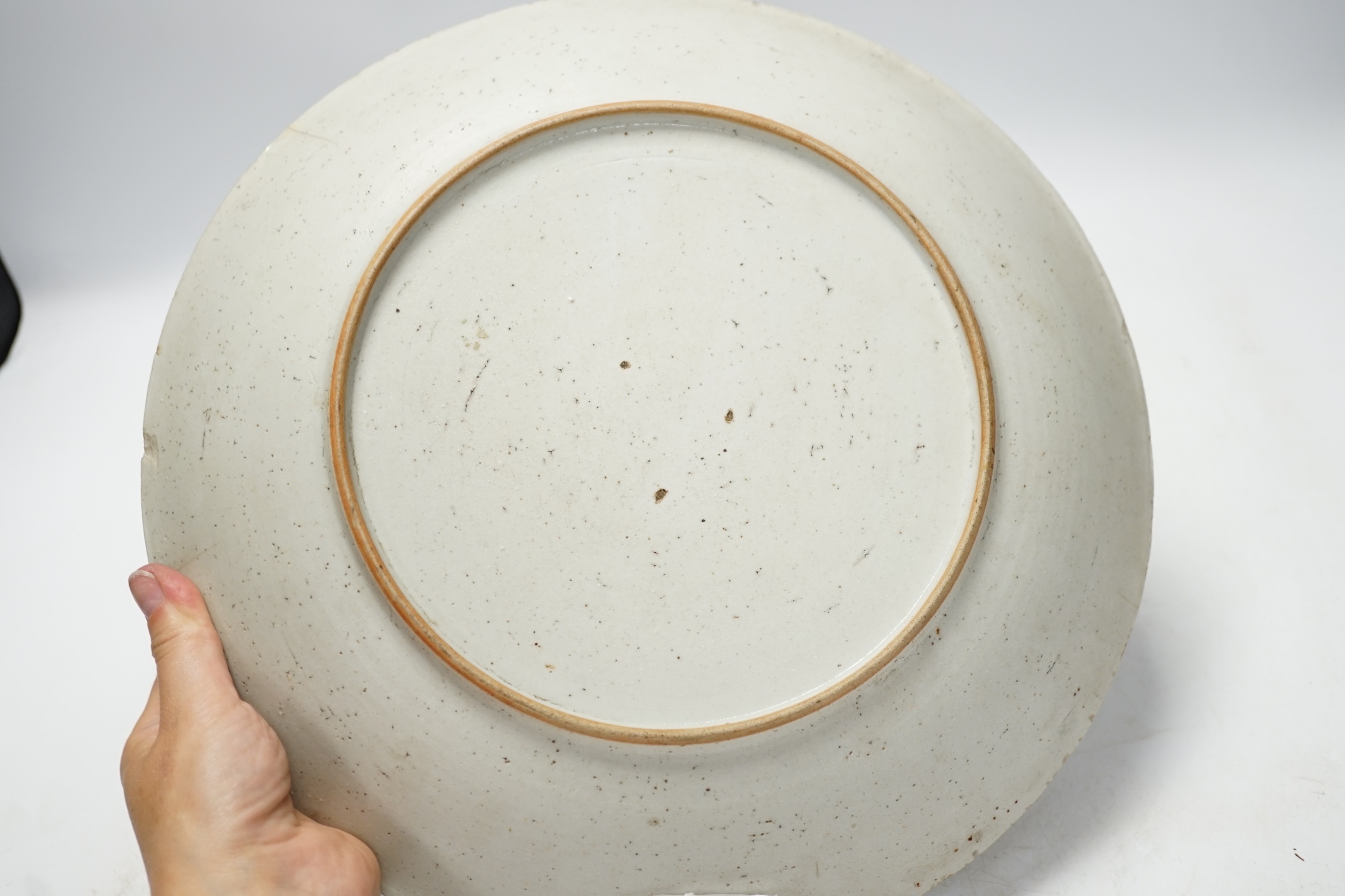 A 19th century Chinese famille rose dish, possibly Thai market, 32cm diameter. Condition - poor to fair